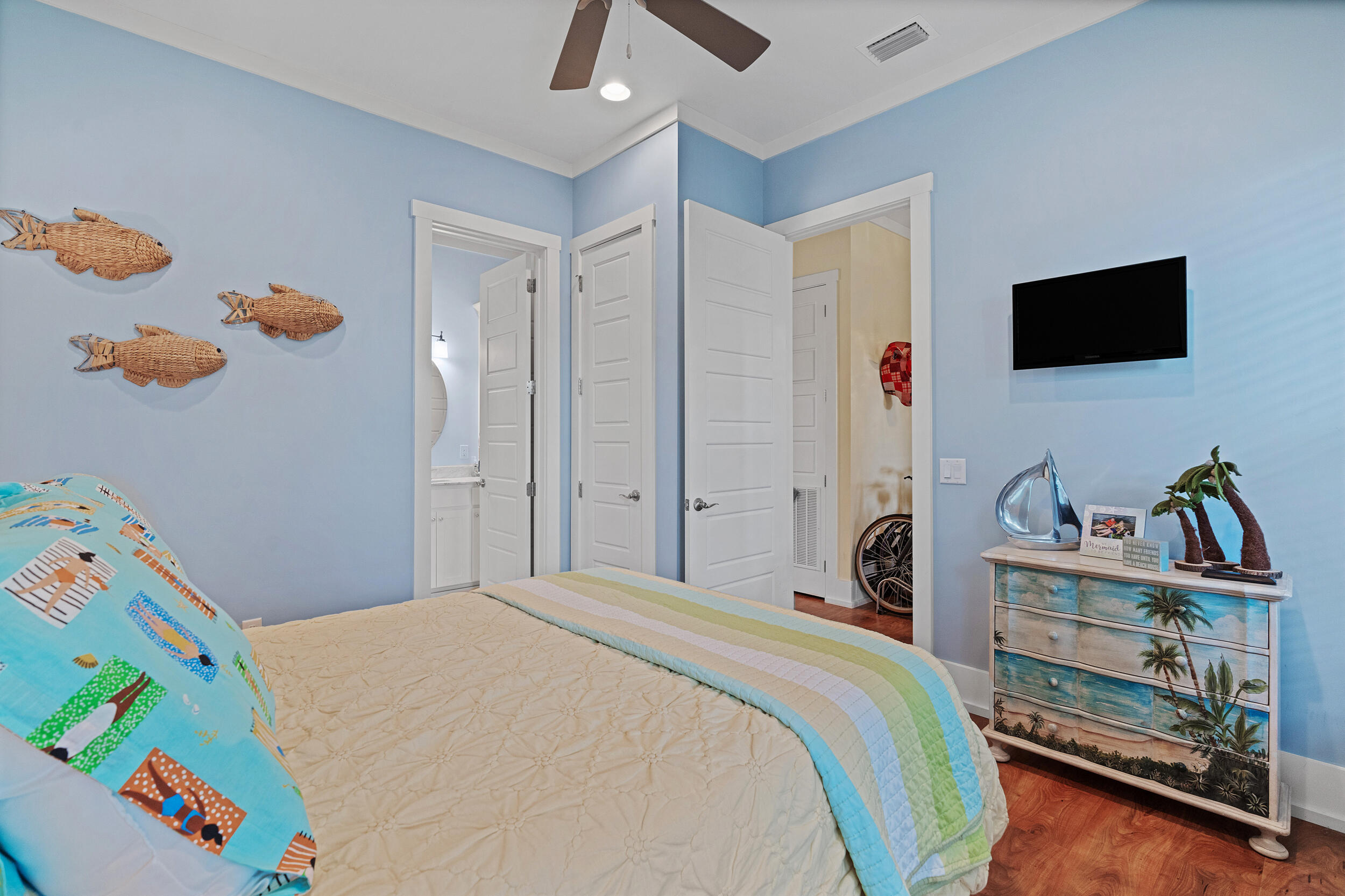 34 Blue Dolphin Loop Inlet Beach, FL 32461 - Photo 22 of 45 a bedroom with a bed and a flat tv screen on the dresser