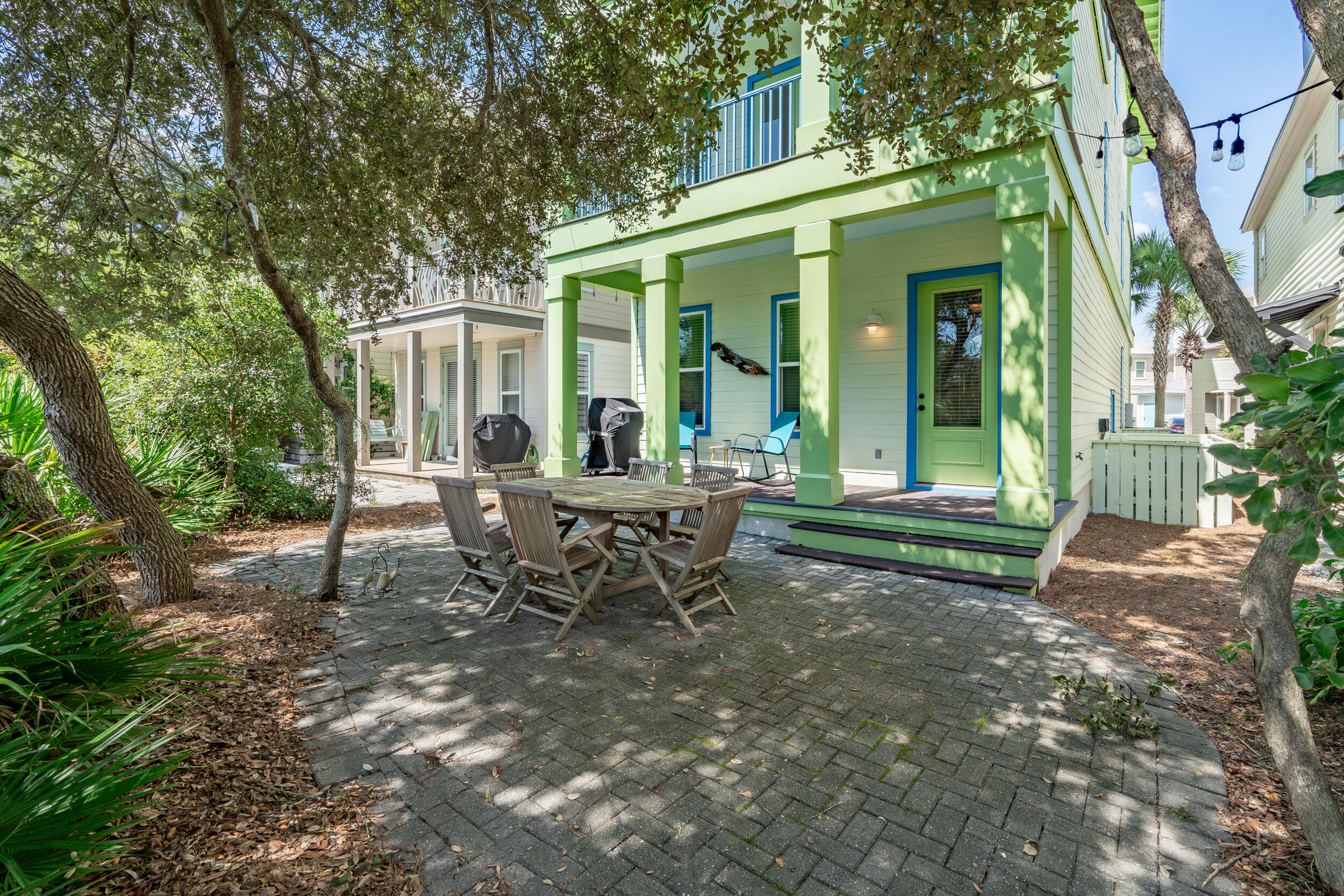 34 Blue Dolphin Loop Inlet Beach, FL 32461 - Photo 5 of 45 a view of a house with backyard sitting area and garden