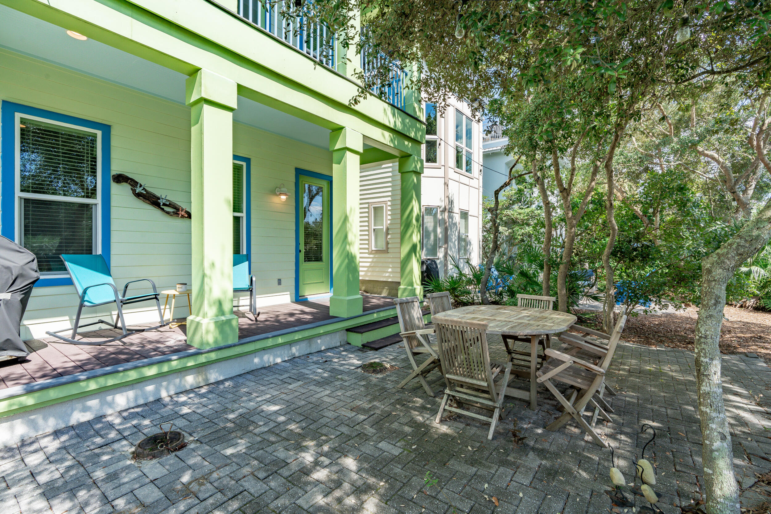 34 Blue Dolphin Loop Inlet Beach, FL 32461 - Photo 6 of 45 a view of a chair and table in backyard of the house