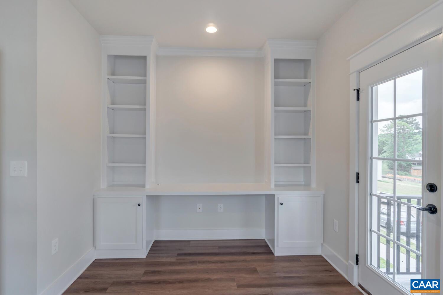 151 Agatha Ridge Lane Crozet, VA 22932 - Photo 17 of 52 a view of an empty room with wooden floor and windows