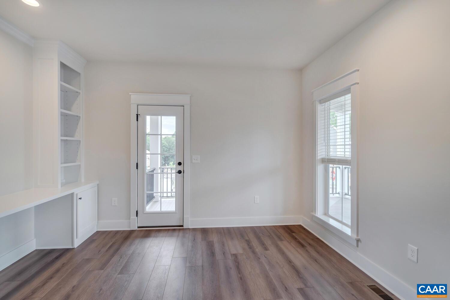 151 Agatha Ridge Lane Crozet, VA 22932 - Photo 18 of 52 an empty room with wooden floor and windows