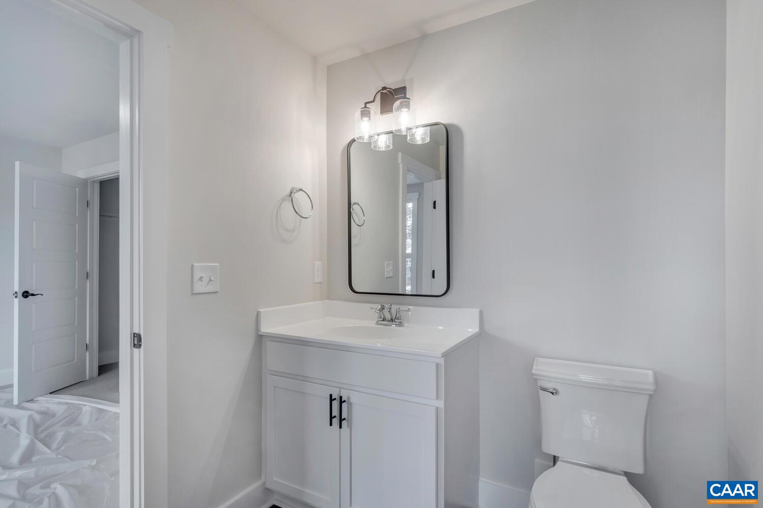 151 Agatha Ridge Lane Crozet, VA 22932 - Photo 39 of 52 a bathroom with a toilet sink and mirror