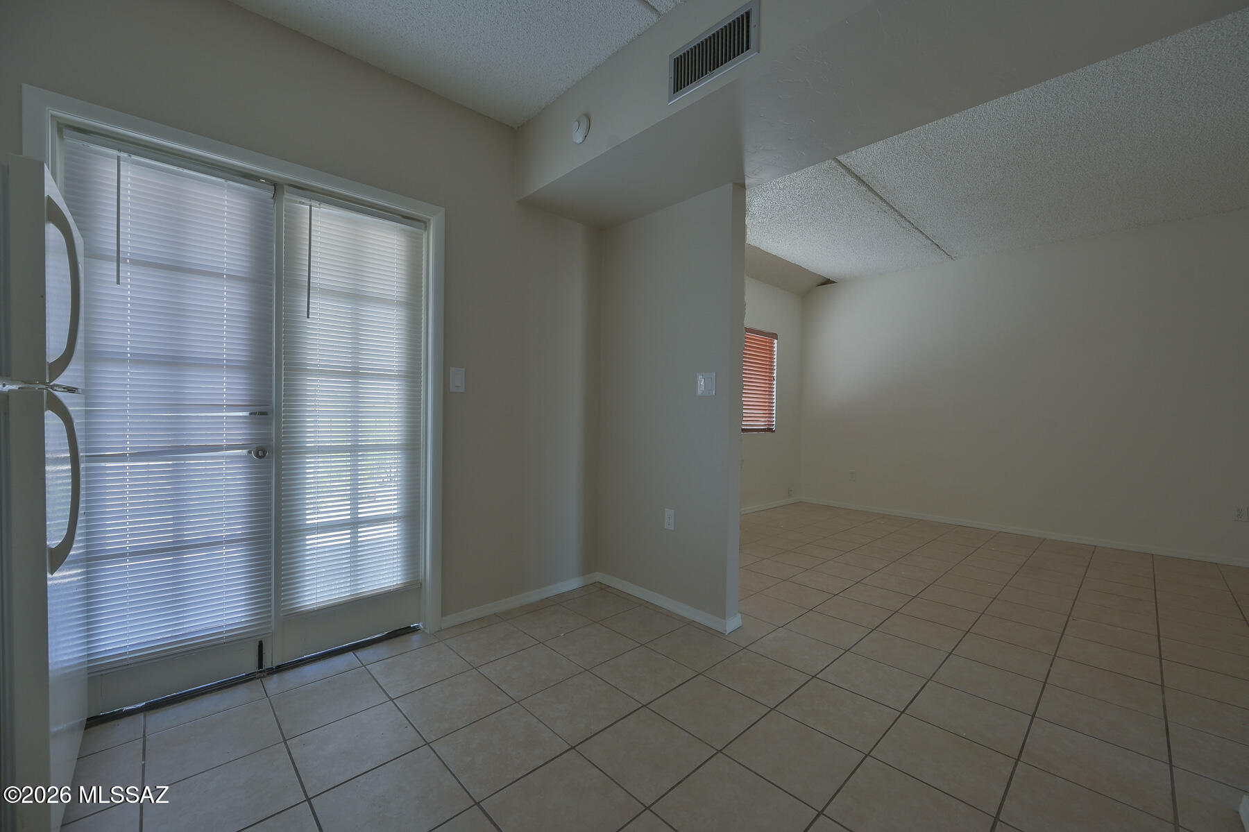 7777 East Golf Links Road, Unit 2308 Tucson, AZ 85730 - Photo 19 of 37 an empty room with windows