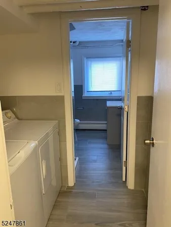 a view of hallway with wooden floor