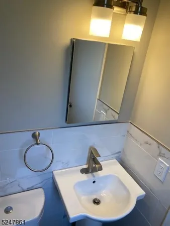 a bathroom with a sink and mirror