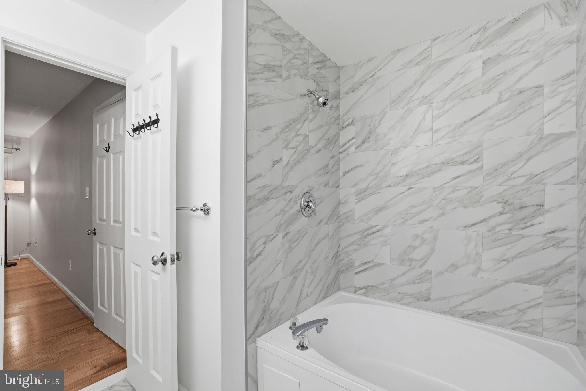 1495 Church Hill Place Reston, VA 20194 - Photo 19 of 27 a bathroom with a bathtub