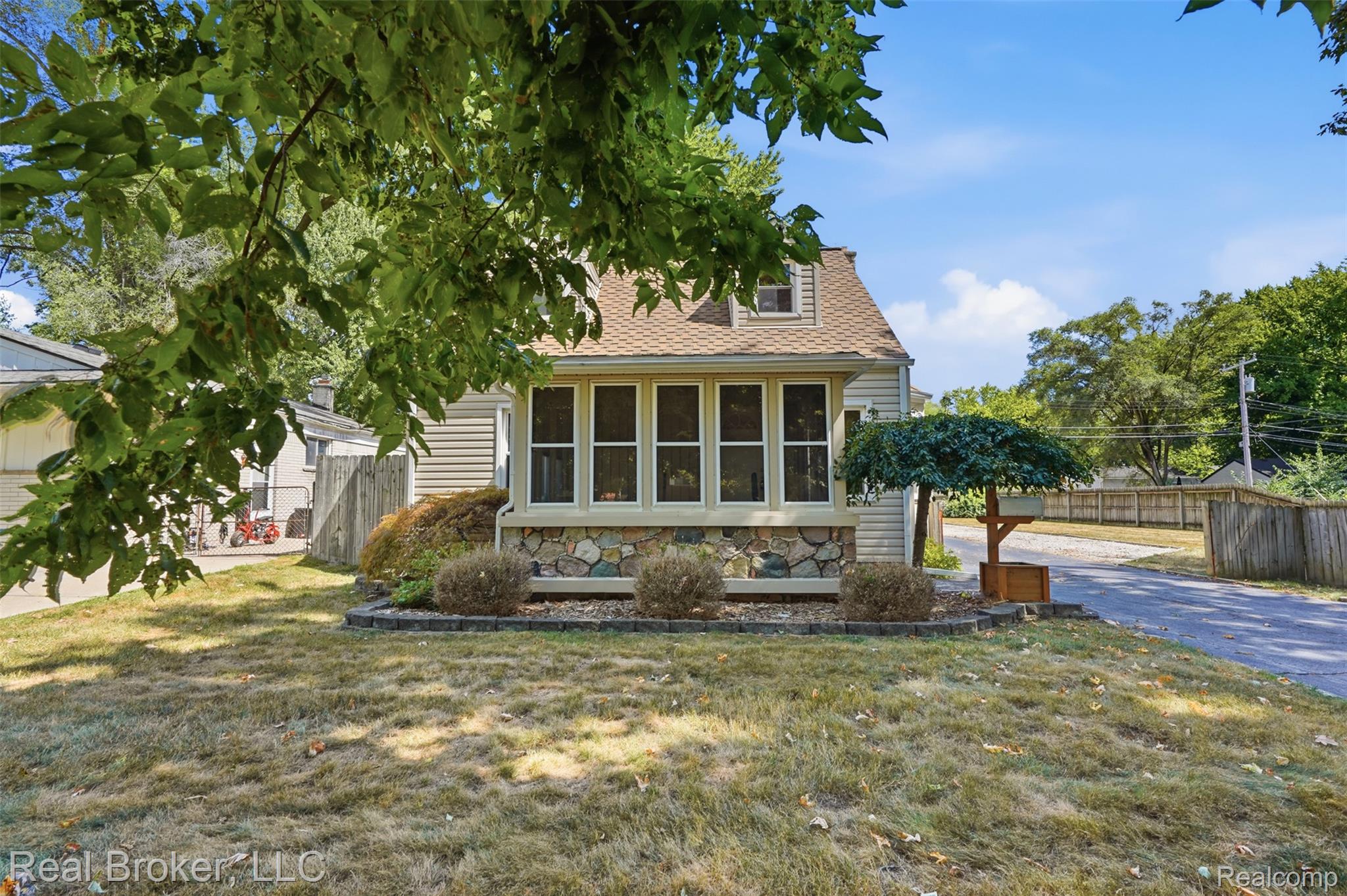 19410 Rensellor Street Livonia, MI 48152 - Photo 1 of 33 Front yard screened in porch.