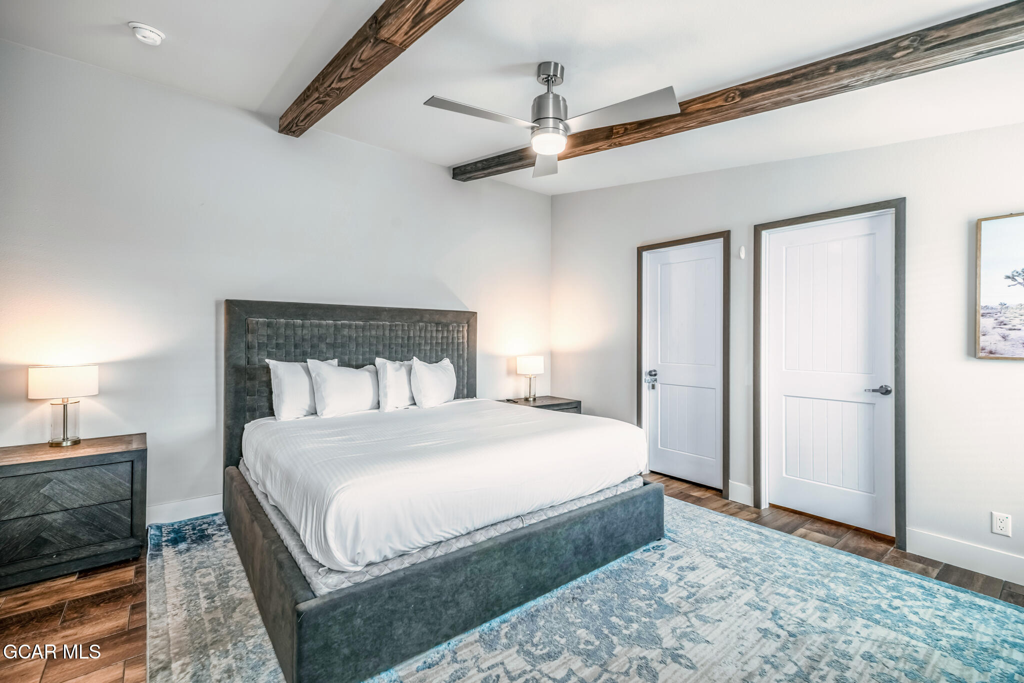 1051 Summit Trail Granby, CO 80446 - Photo 12 of 66 a bedroom with a bed and a flat screen tv