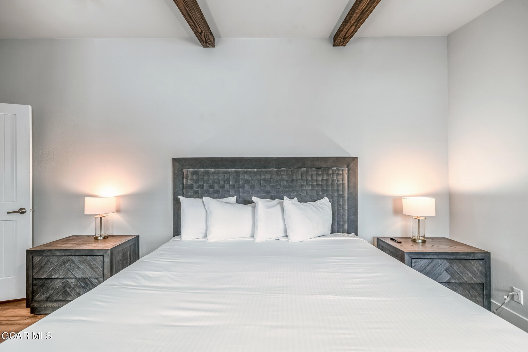 1051 Summit Trail Granby, CO 80446 - Photo 13 of 66 a bedroom with a bed and a lamp