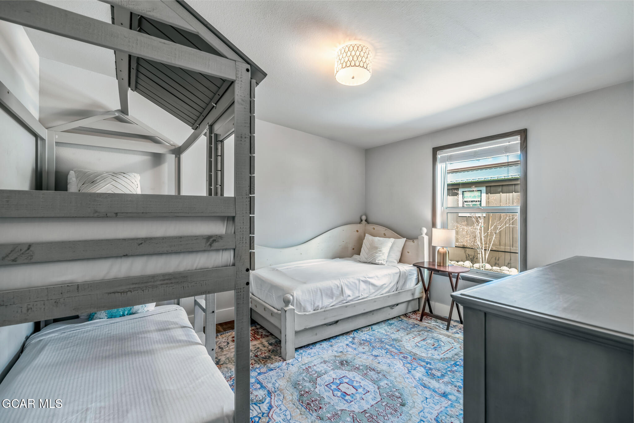 1051 Summit Trail Granby, CO 80446 - Photo 19 of 66 a bedroom with a bed and a window