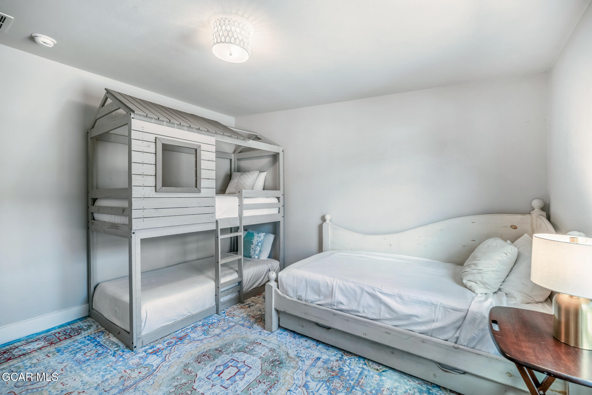 1051 Summit Trail Granby, CO 80446 - Photo 21 of 66 a bedroom with a bed and a chair in it