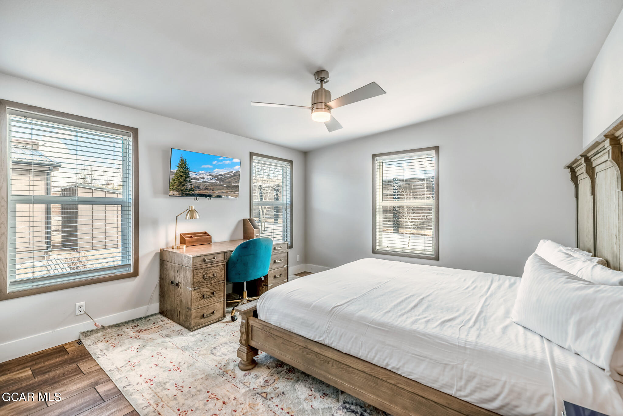 1051 Summit Trail Granby, CO 80446 - Photo 22 of 66 a bedroom with a bed dresser and a window