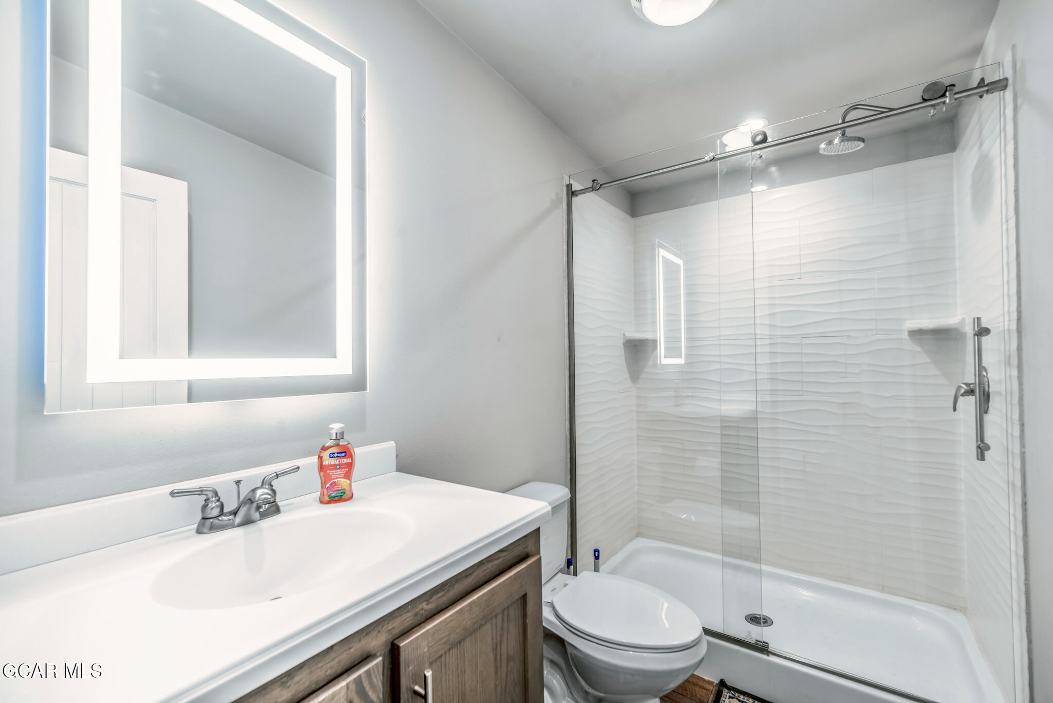 1051 Summit Trail Granby, CO 80446 - Photo 23 of 66 a bathroom with a sink toilet vanity and shower