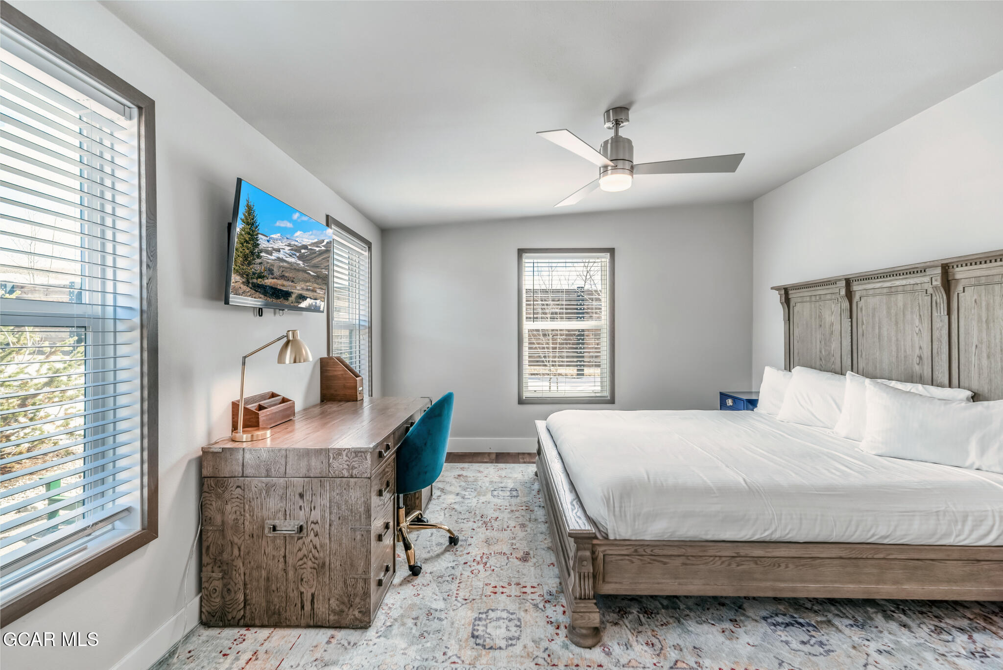 1051 Summit Trail Granby, CO 80446 - Photo 24 of 66 a bedroom with a bed a window and a flat screen television