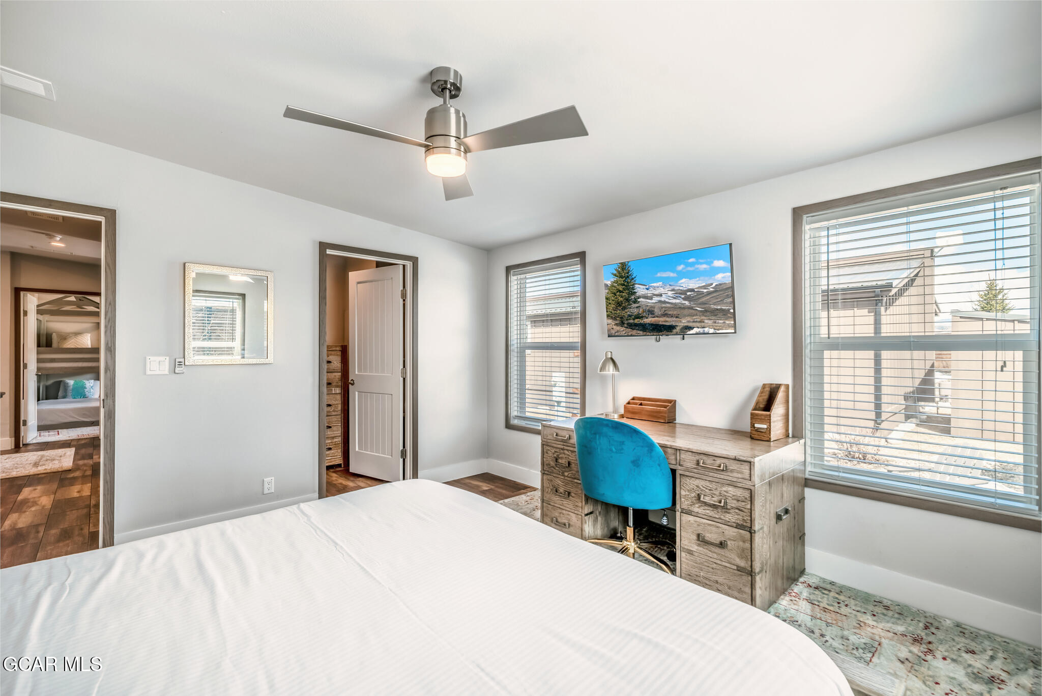 1051 Summit Trail Granby, CO 80446 - Photo 27 of 66 a bedroom with a bed a desk and chair