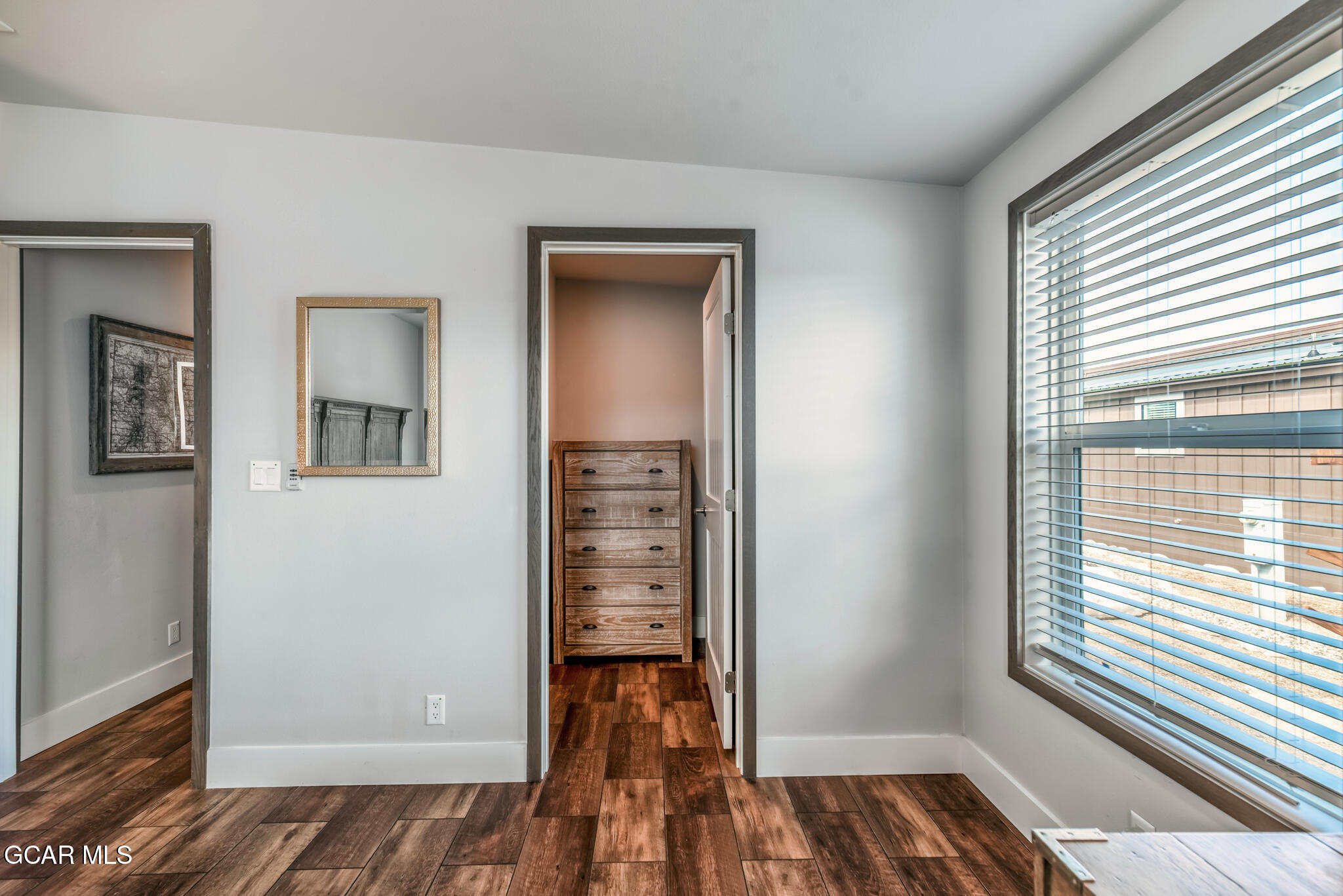 1051 Summit Trail Granby, CO 80446 - Photo 28 of 66 a view of a room with wooden floor closet and windows