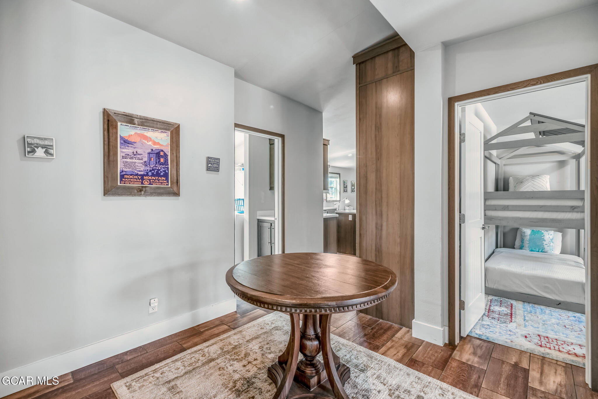 1051 Summit Trail Granby, CO 80446 - Photo 54 of 66 a view of a hallway with a livingroom and furniture