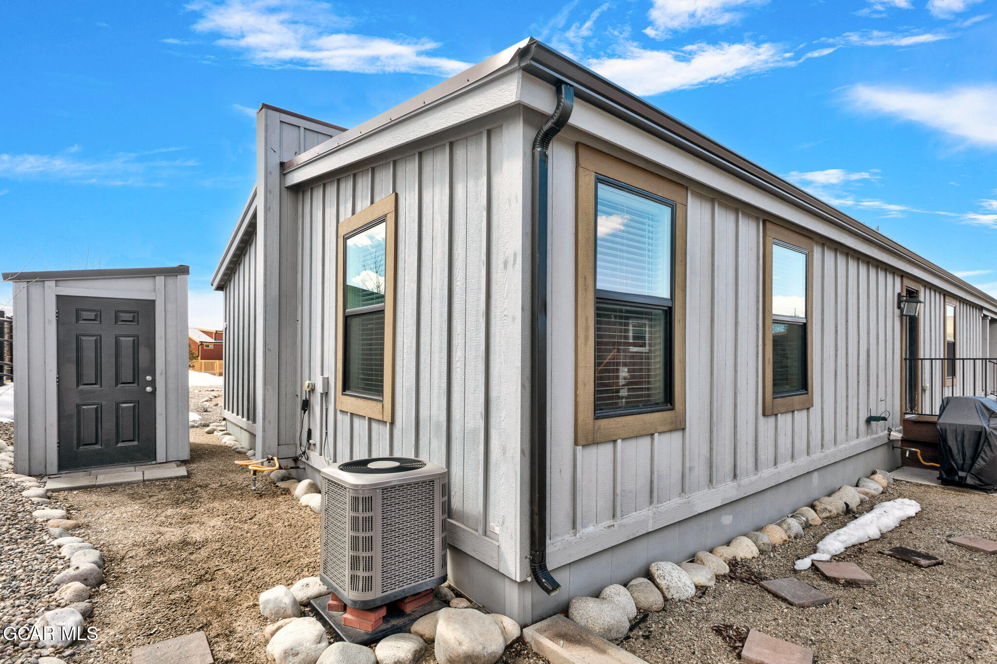 1051 Summit Trail Granby, CO 80446 - Photo 56 of 66 a front view of a house with large windows