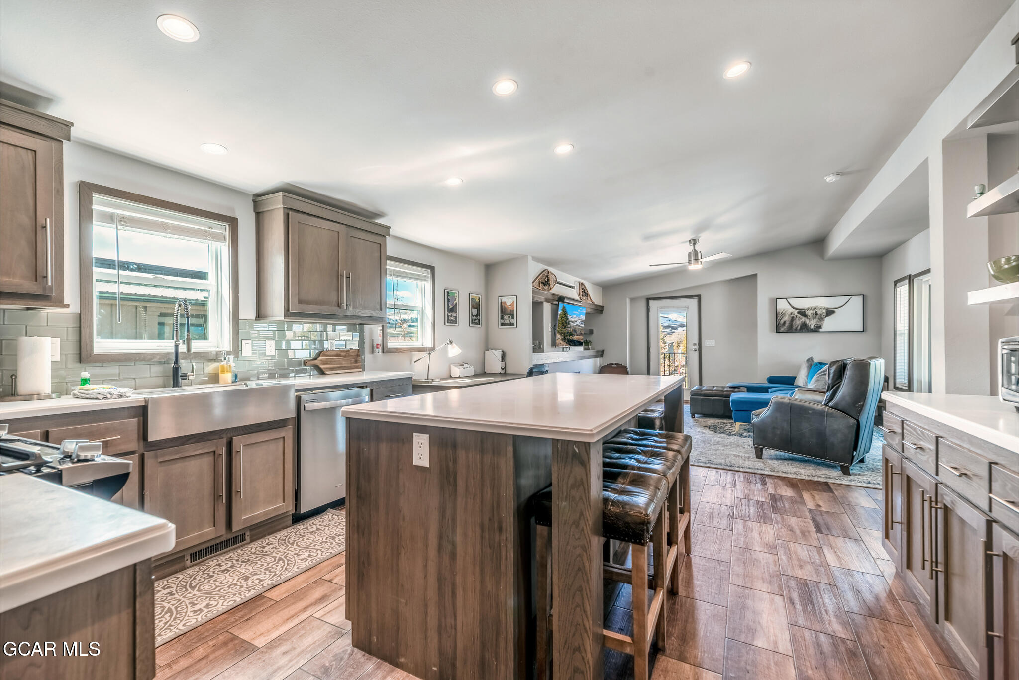 1051 Summit Trail Granby, CO 80446 - Photo 7 of 66 a living room with stainless steel appliances granite countertop furniture wooden floor and a window