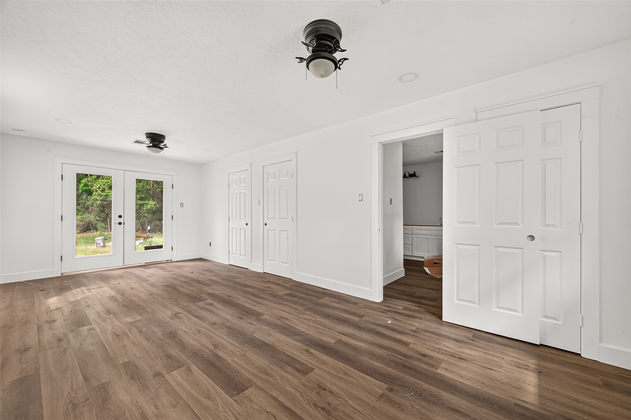 6222 Farm To Market 1010 Road Cleveland, TX 77327 - Photo 24 of 34 Bedroom with direct bath access and French doors
