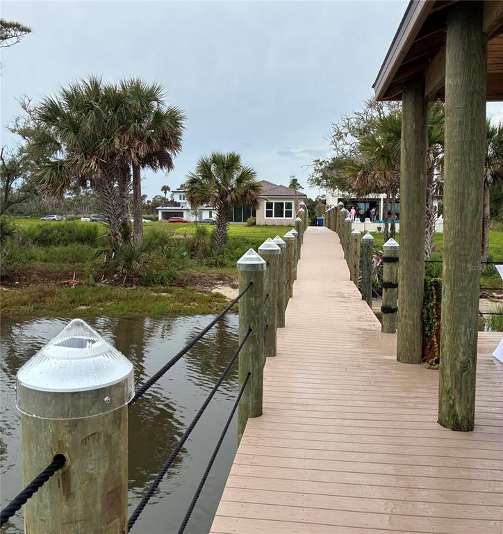 4 Coronado Road Flagler Beach, FL 32136 - Photo 25 of 30 a swimming pool with a outdoor seating and yard