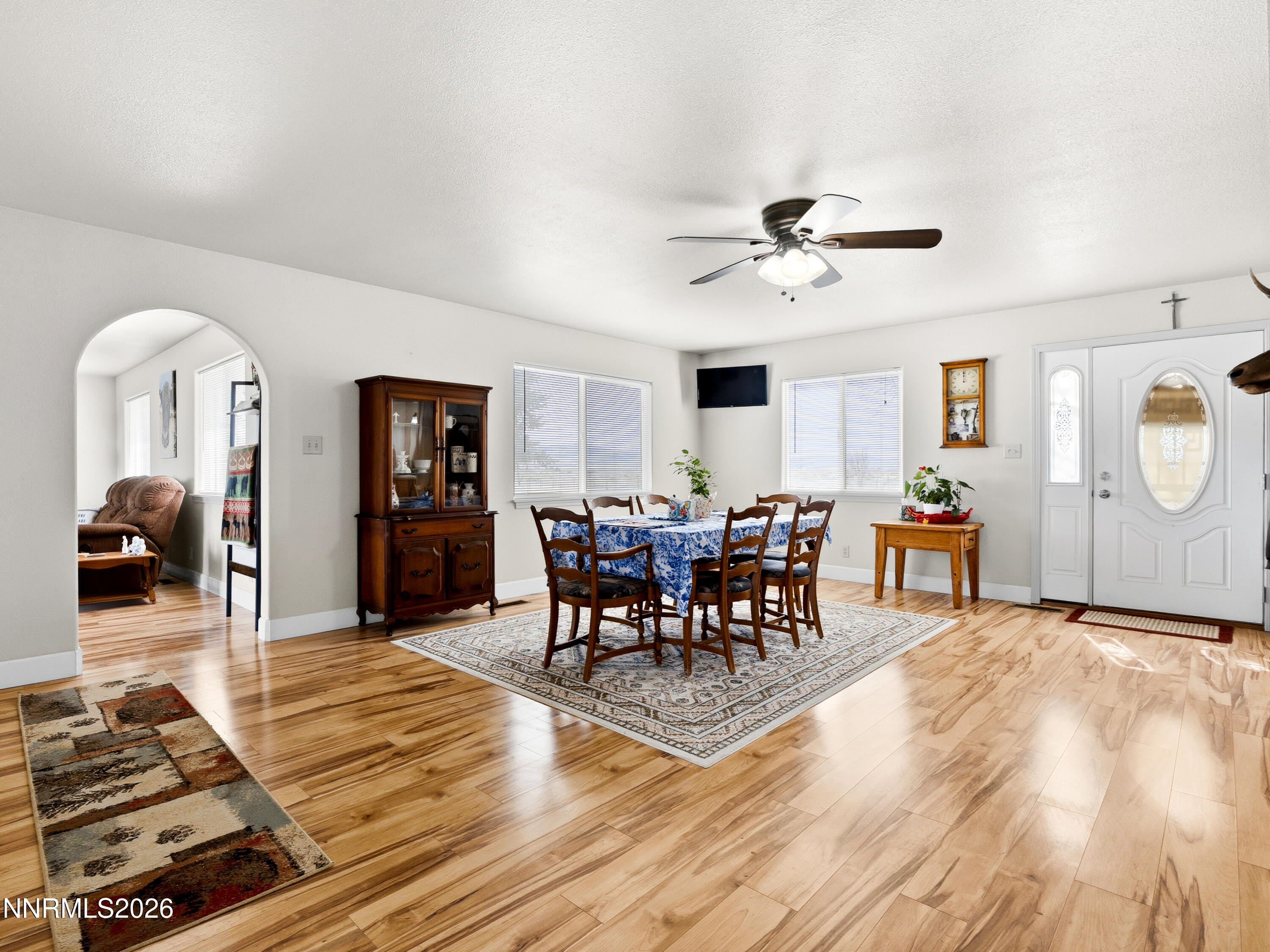 2625 Muddy Road Winnemucca, NV 89445 - Photo 31 of 49 a living room with furniture a wooden floor and a chandelier