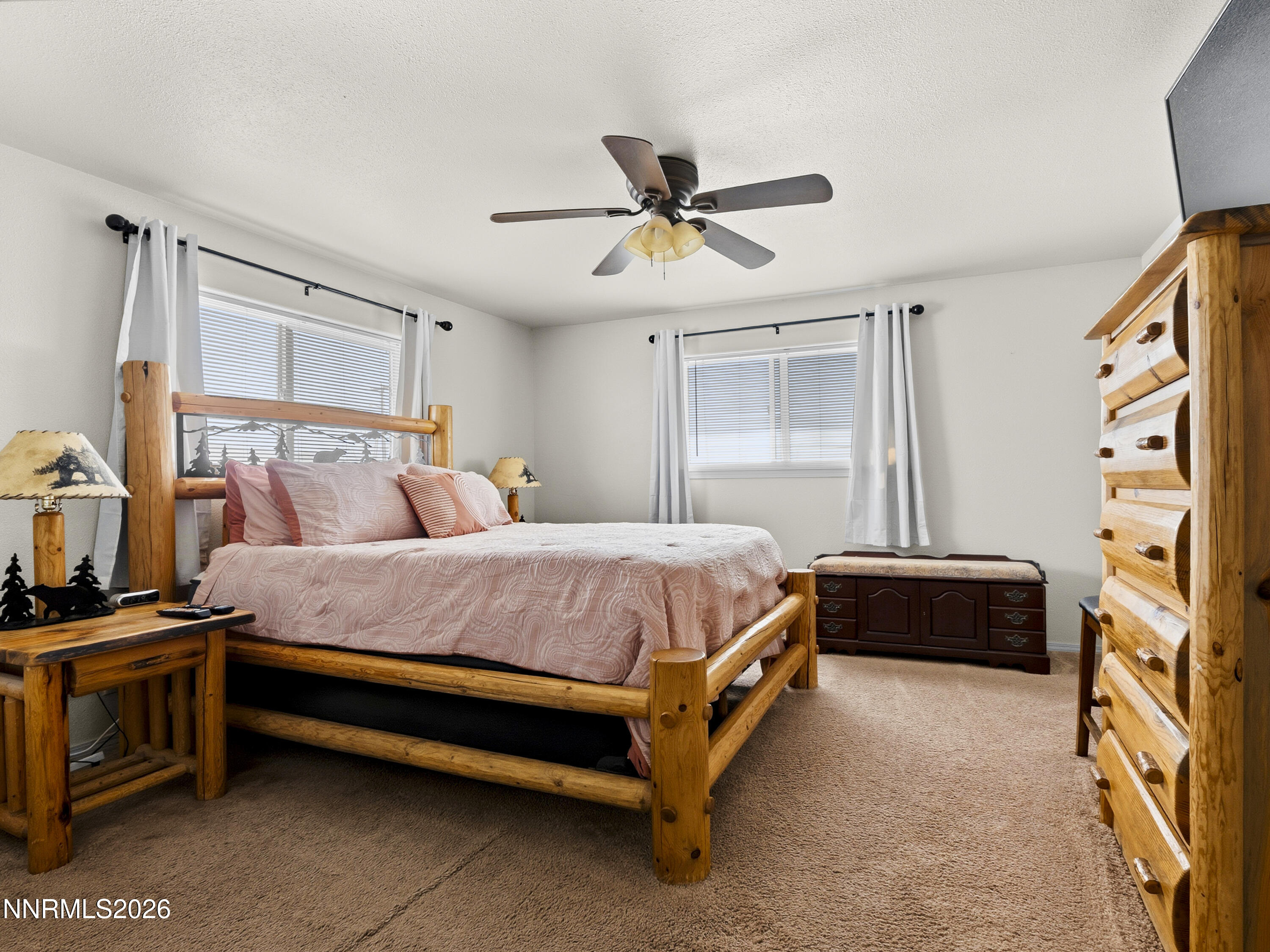 2625 Muddy Road Winnemucca, NV 89445 - Photo 42 of 49 a spacious bedroom with a bed and a chandelier