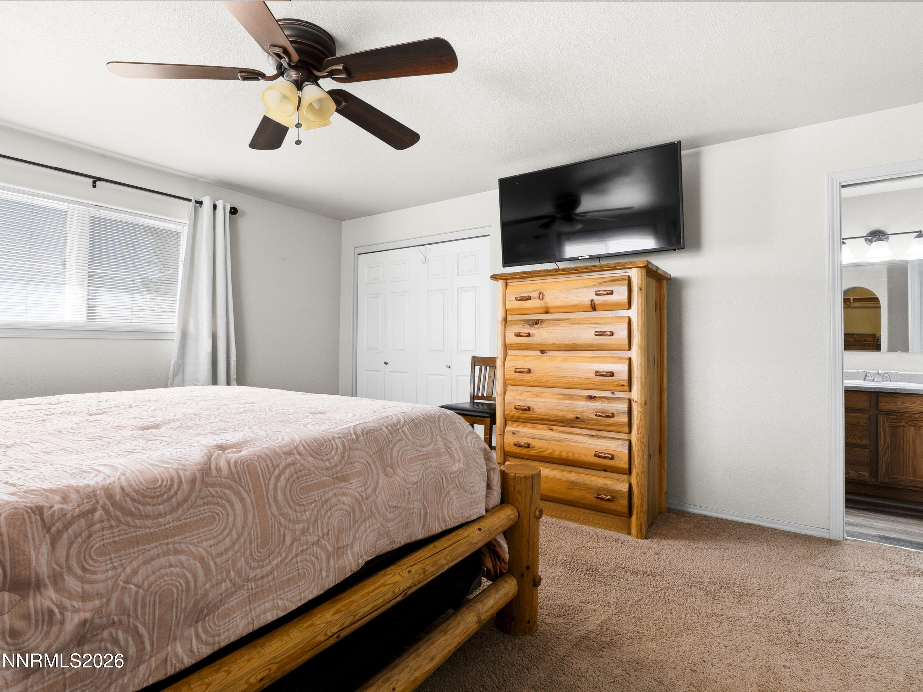 2625 Muddy Road Winnemucca, NV 89445 - Photo 43 of 49 a bedroom with a bed and a flat screen tv
