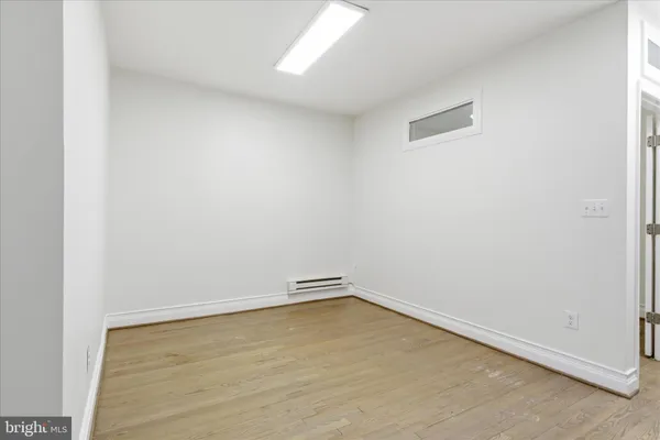 an empty room with a bench