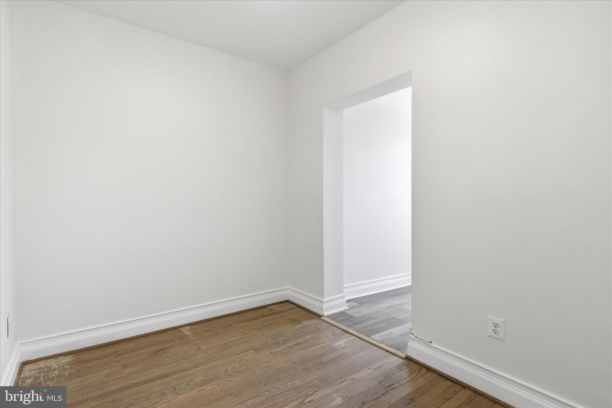 221 20th Street Northeast, Unit 3 Washington, DC 20002 - Photo 17 of 30 a view of an empty room with wooden floor