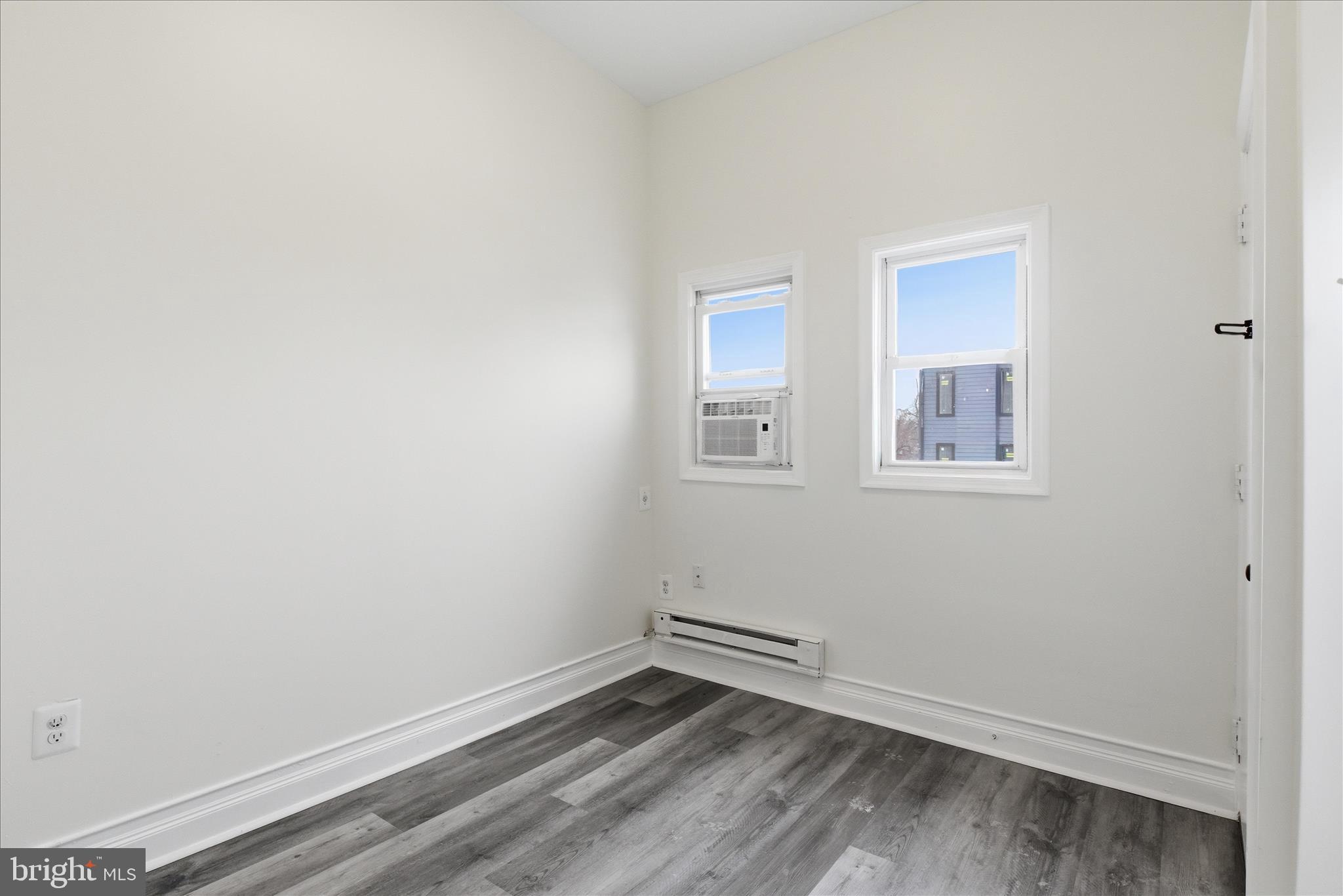 221 20th Street Northeast, Unit 3 Washington, DC 20002 - Photo 19 of 30 an empty room with windows