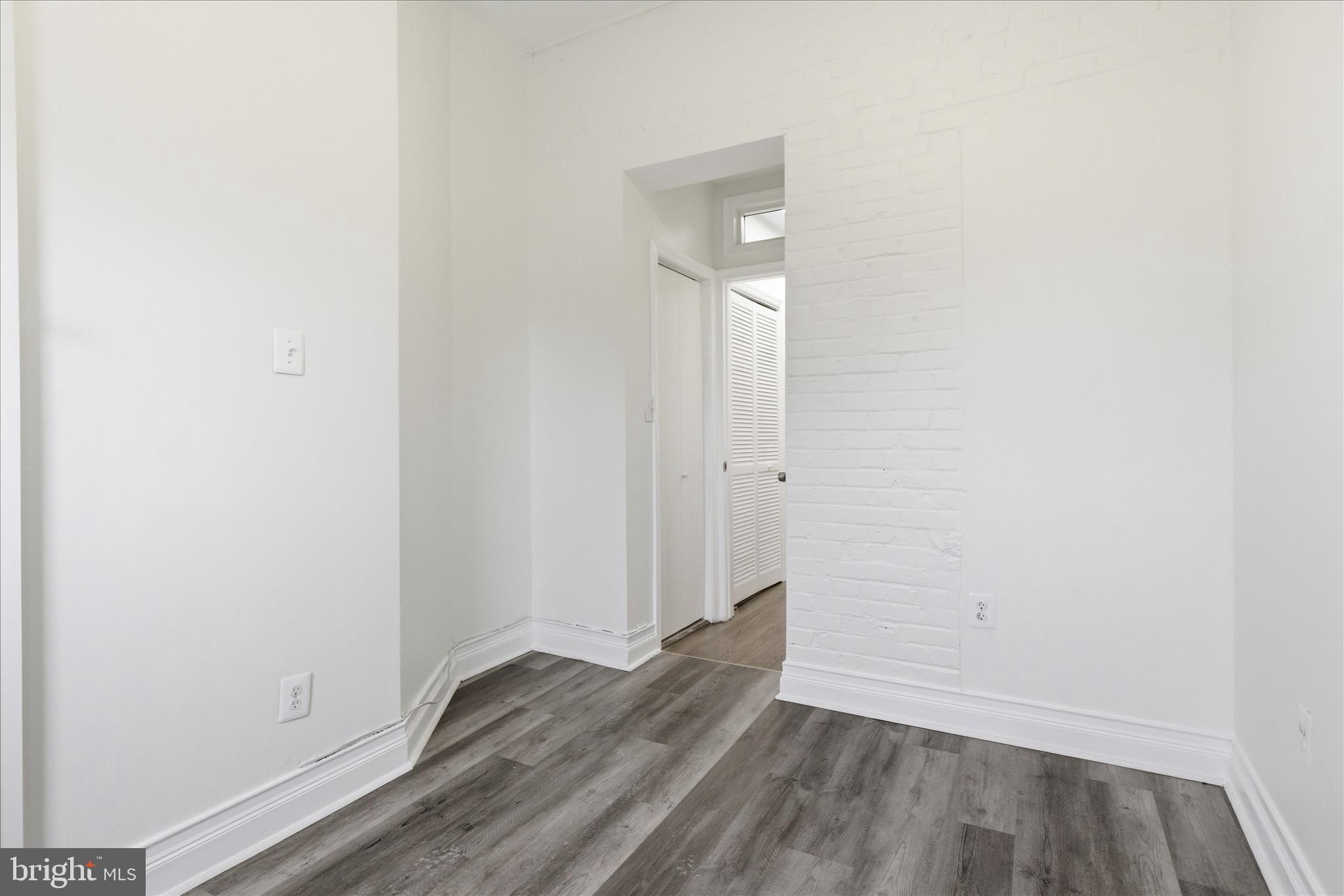 221 20th Street Northeast, Unit 3 Washington, DC 20002 - Photo 20 of 30 a view of an empty room with wooden floor