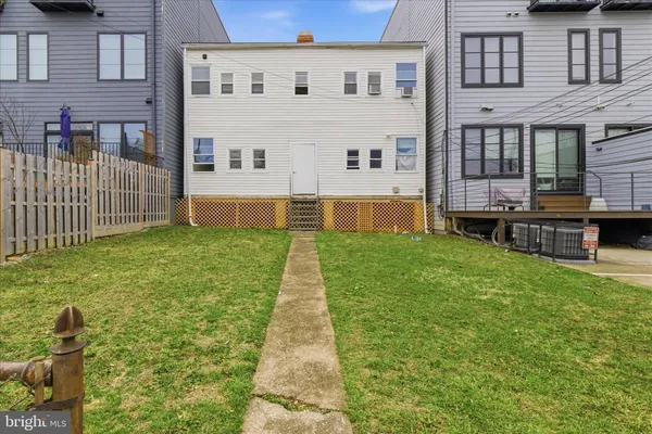 a view of house with yard