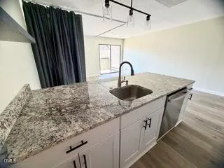 a kitchen with sink and window
