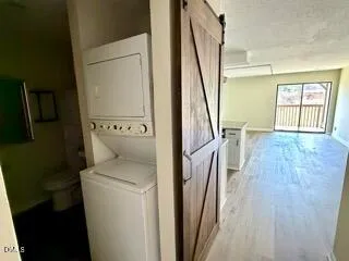 a view of washer and dryer with wooden floor