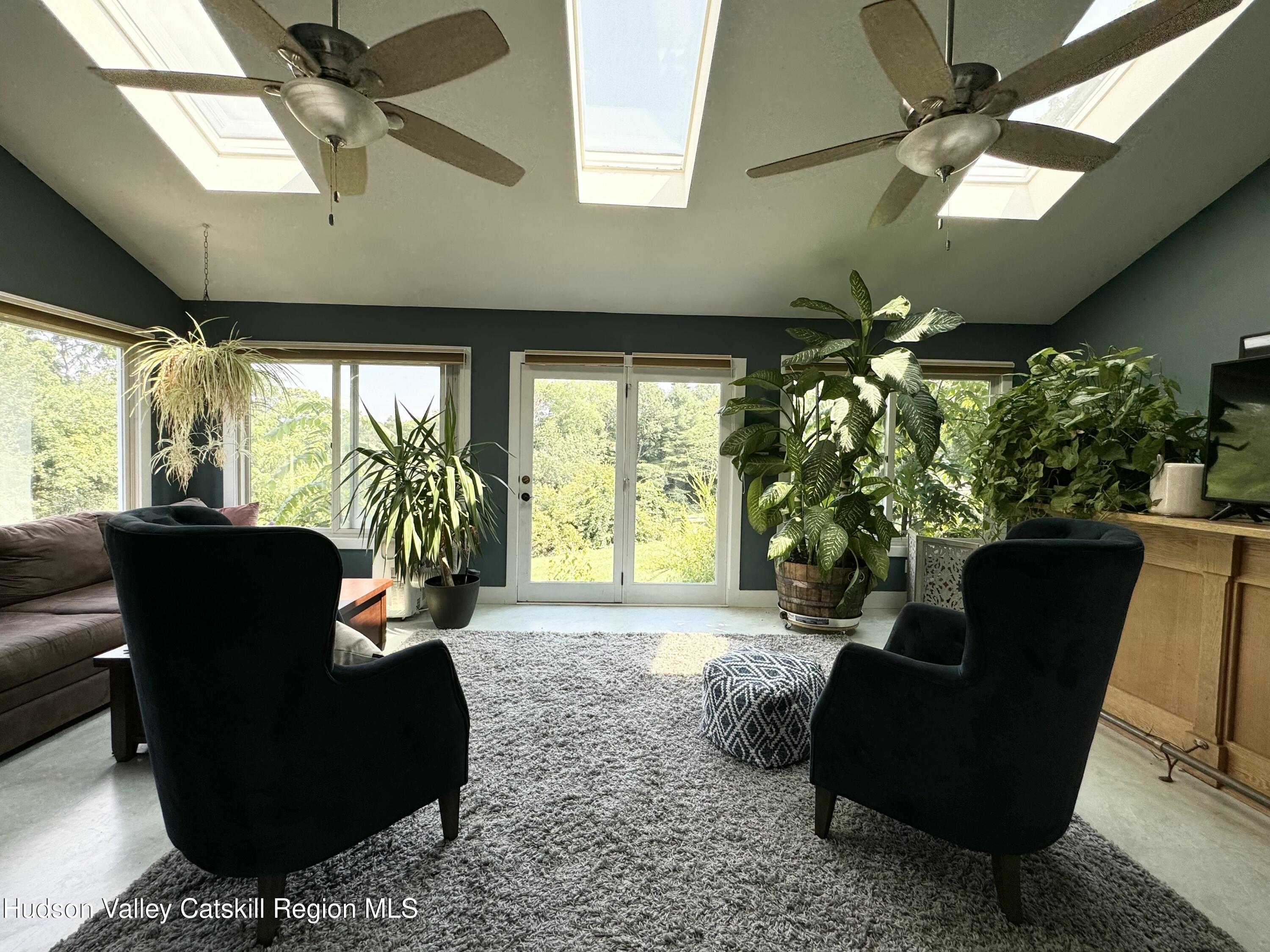 1476 County Rte 5 Canaan, NY 12029 - Photo 17 of 38 a living room with furniture and a large window