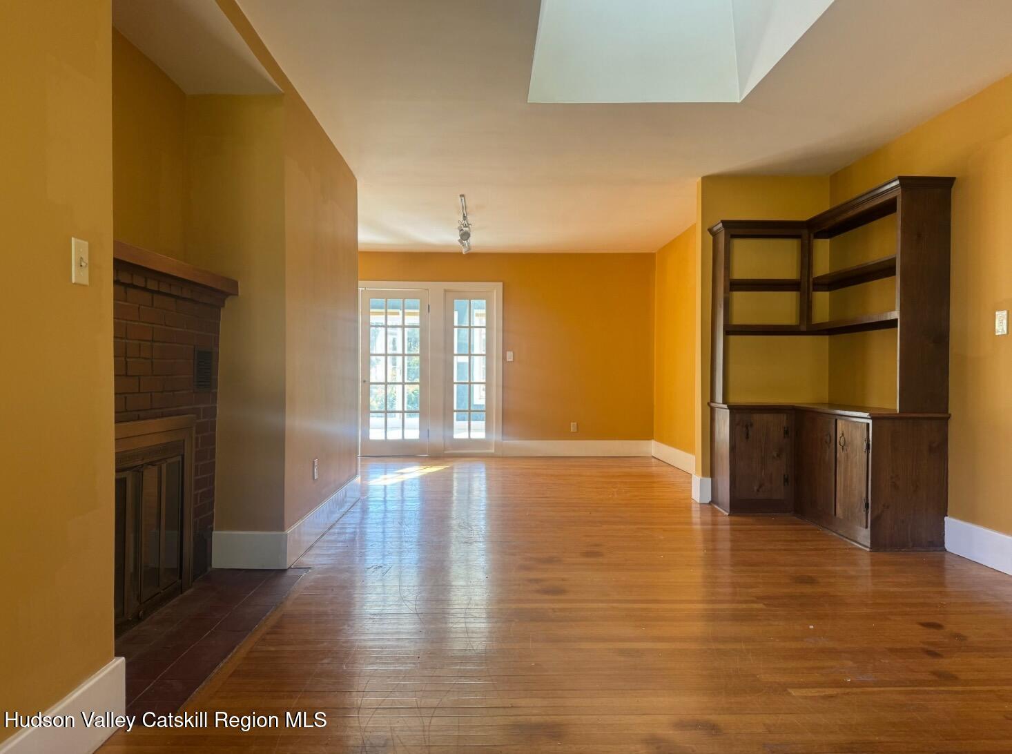 1476 County Rte 5 Canaan, NY 12029 - Photo 6 of 40 a view of empty room with wooden floor and fan