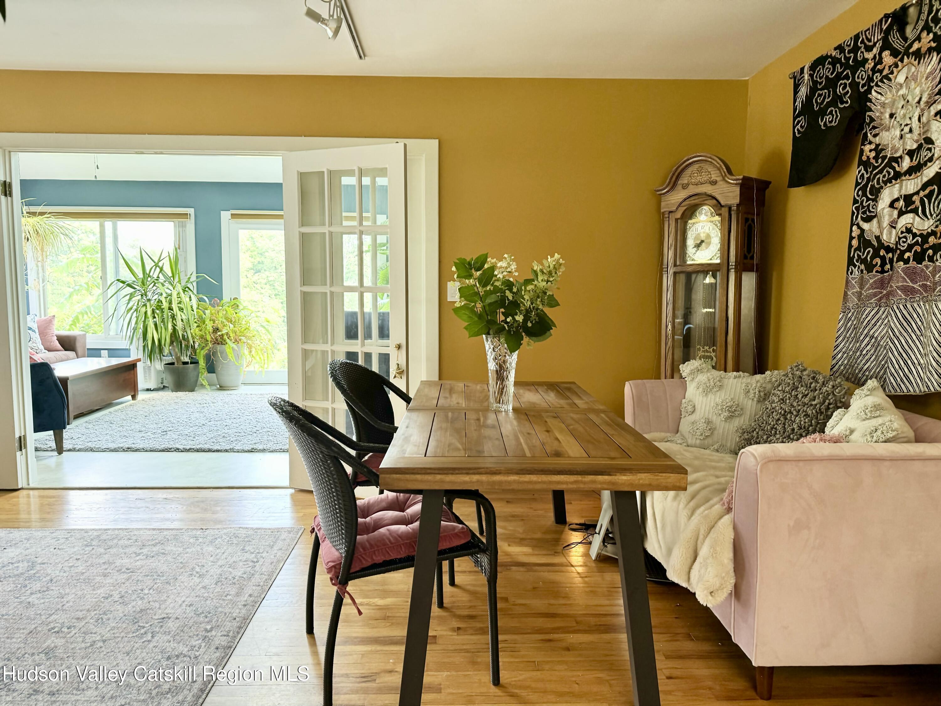 1476 County Rte 5 Canaan, NY 12029 - Photo 7 of 38 a view of a dining room with furniture and a potted plant