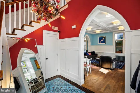 a living room with furniture a fireplace and a window