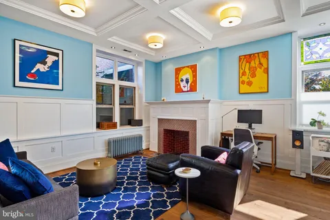 a kitchen with stainless steel appliances granite countertop a stove a sink dishwasher and cabinets with wooden floor