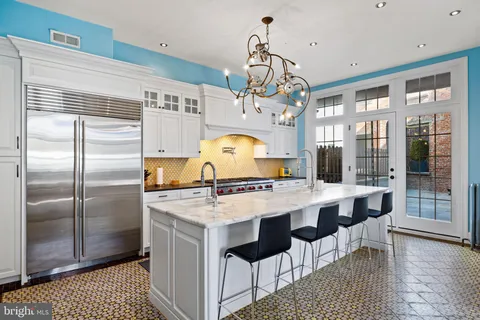 a front view of a building with glass windows and door