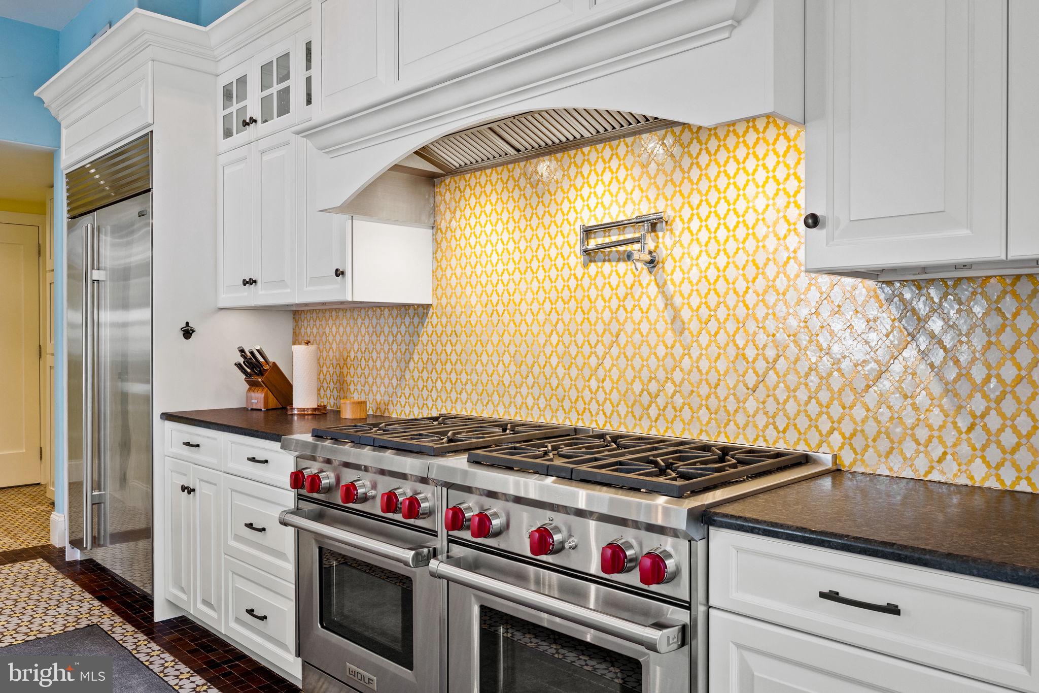 308 Monastery Avenue Philadelphia, PA 19128 - Photo 23 of 70 a kitchen with stainless steel appliances granite countertop a stove and a refrigerator