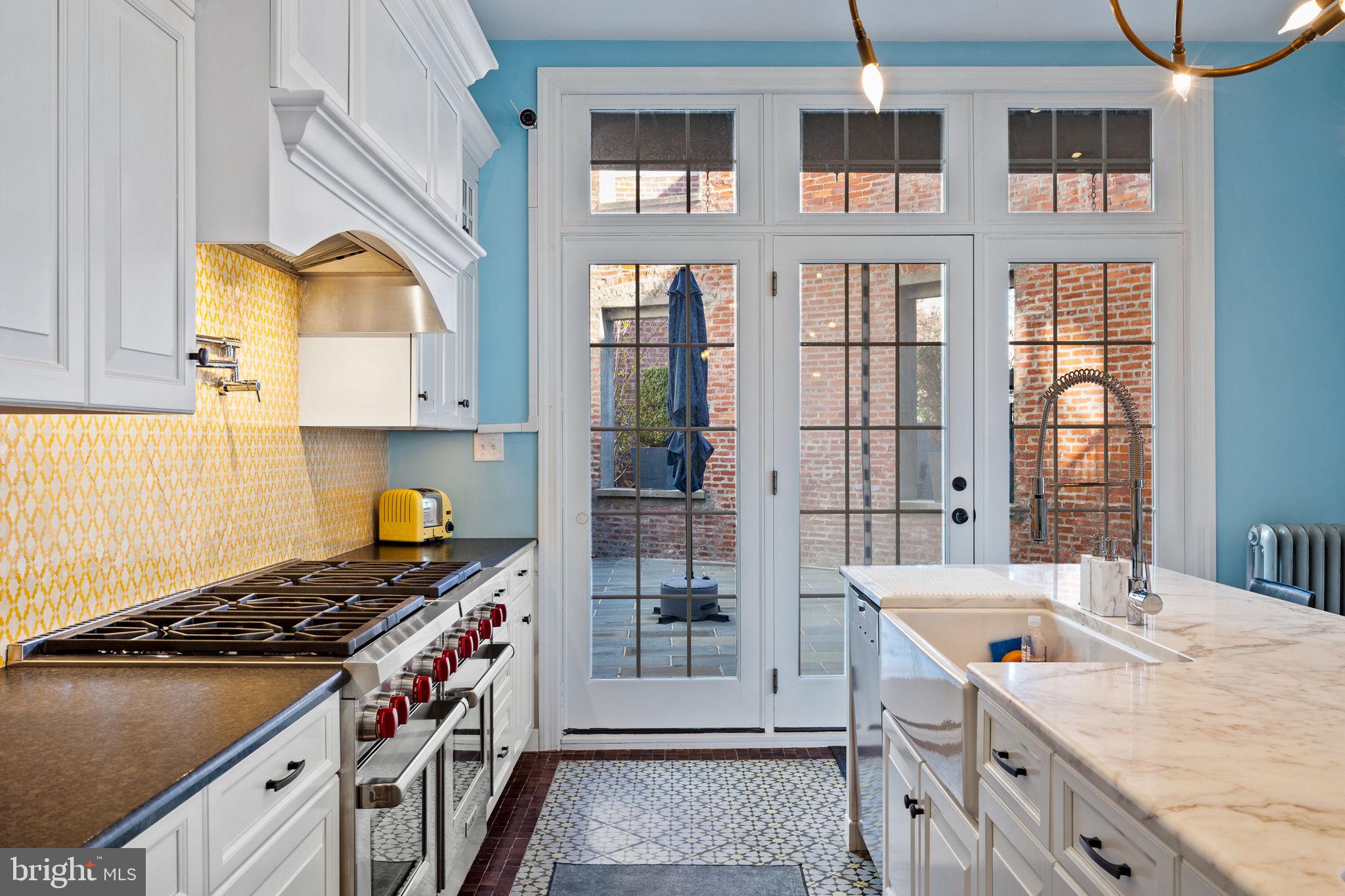 308 Monastery Avenue Philadelphia, PA 19128 - Photo 24 of 70 a kitchen with a stove and a sink