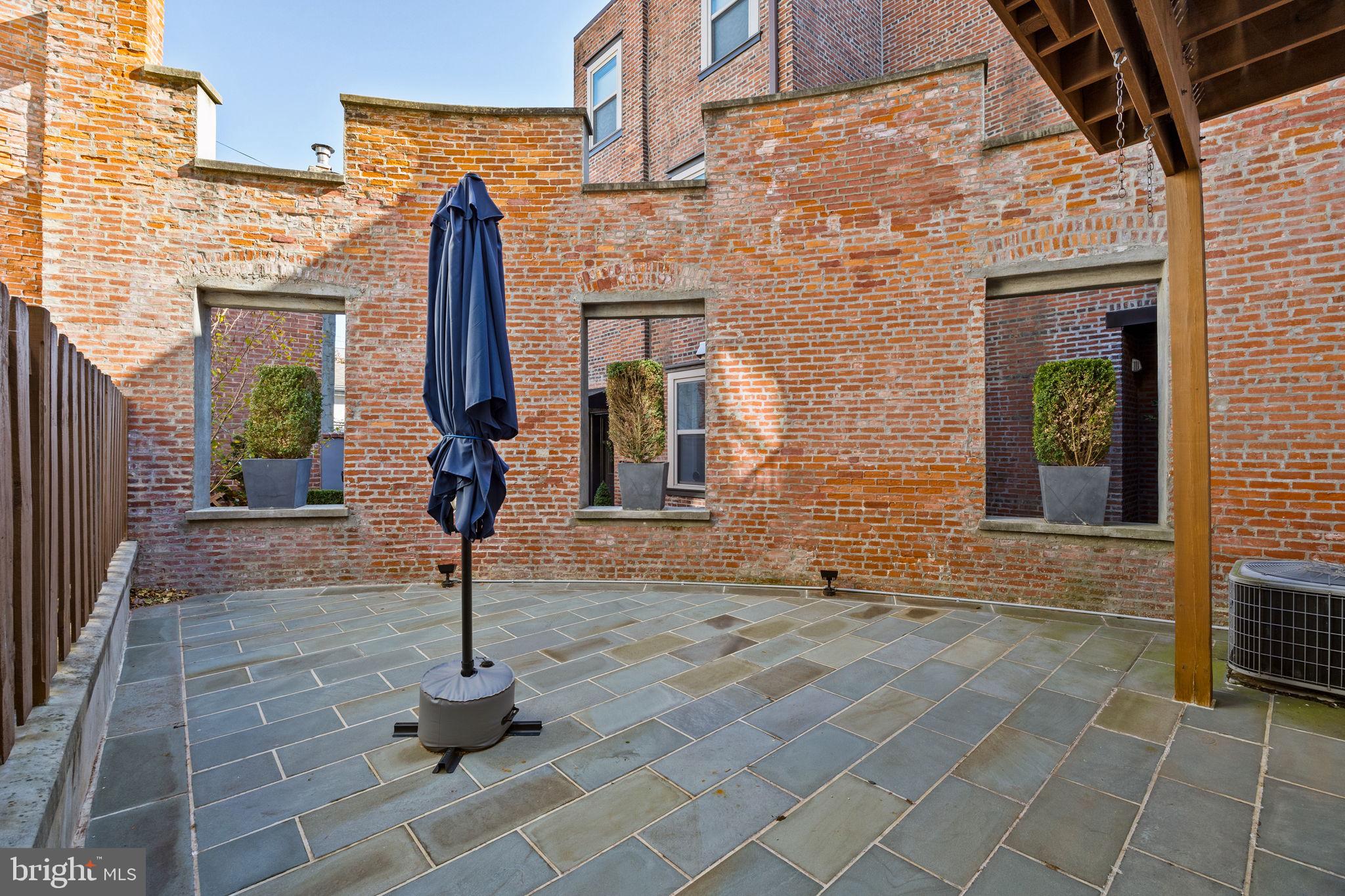 308 Monastery Avenue Philadelphia, PA 19128 - Photo 25 of 70 a front view of a building with glass windows and door