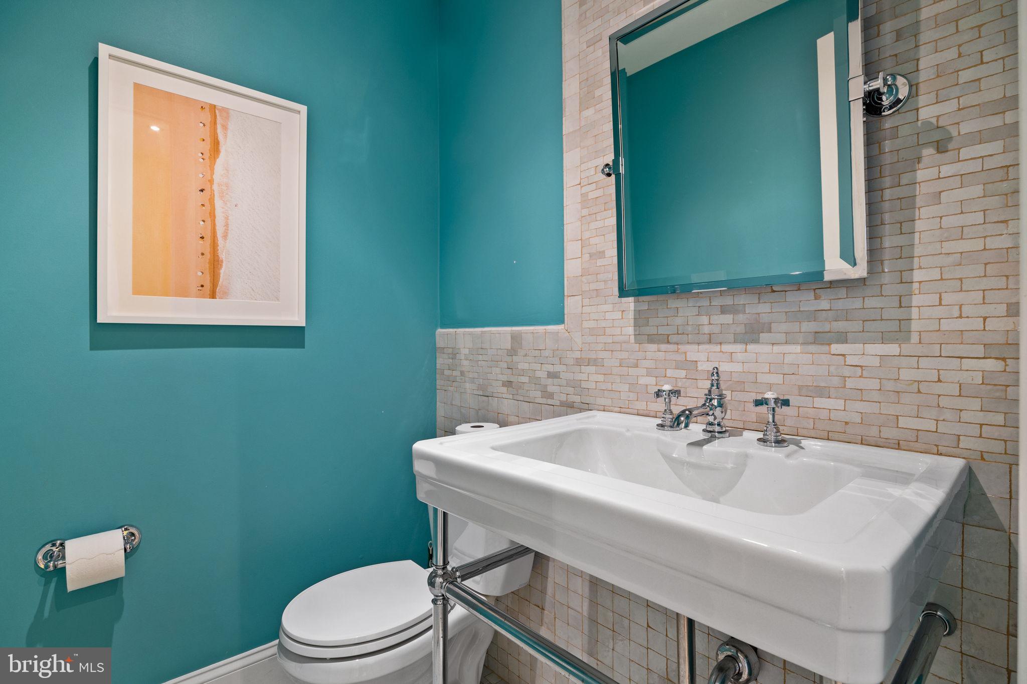 308 Monastery Avenue Philadelphia, PA 19128 - Photo 27 of 70 a bathroom with a sink a toilet and mirror