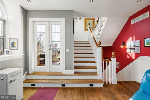 a bedroom with a bed and a chair