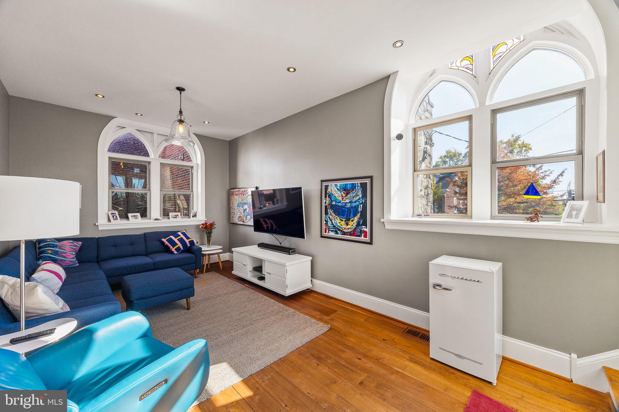 308 Monastery Avenue Philadelphia, PA 19128 - Photo 33 of 70 a living room with furniture and a flat screen tv