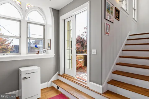 a bathroom with a tub and a window