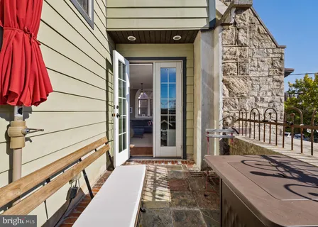 a view of entryway with wooden floor and windows