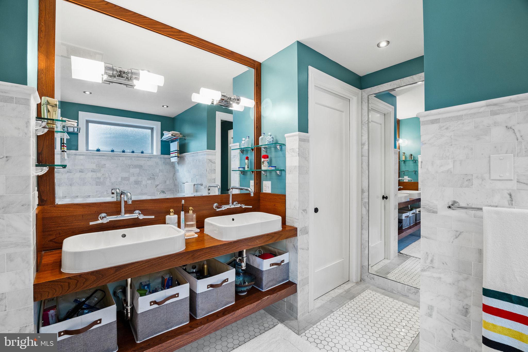 308 Monastery Avenue Philadelphia, PA 19128 - Photo 47 of 70 a bathroom with a sink double vanity and a mirror